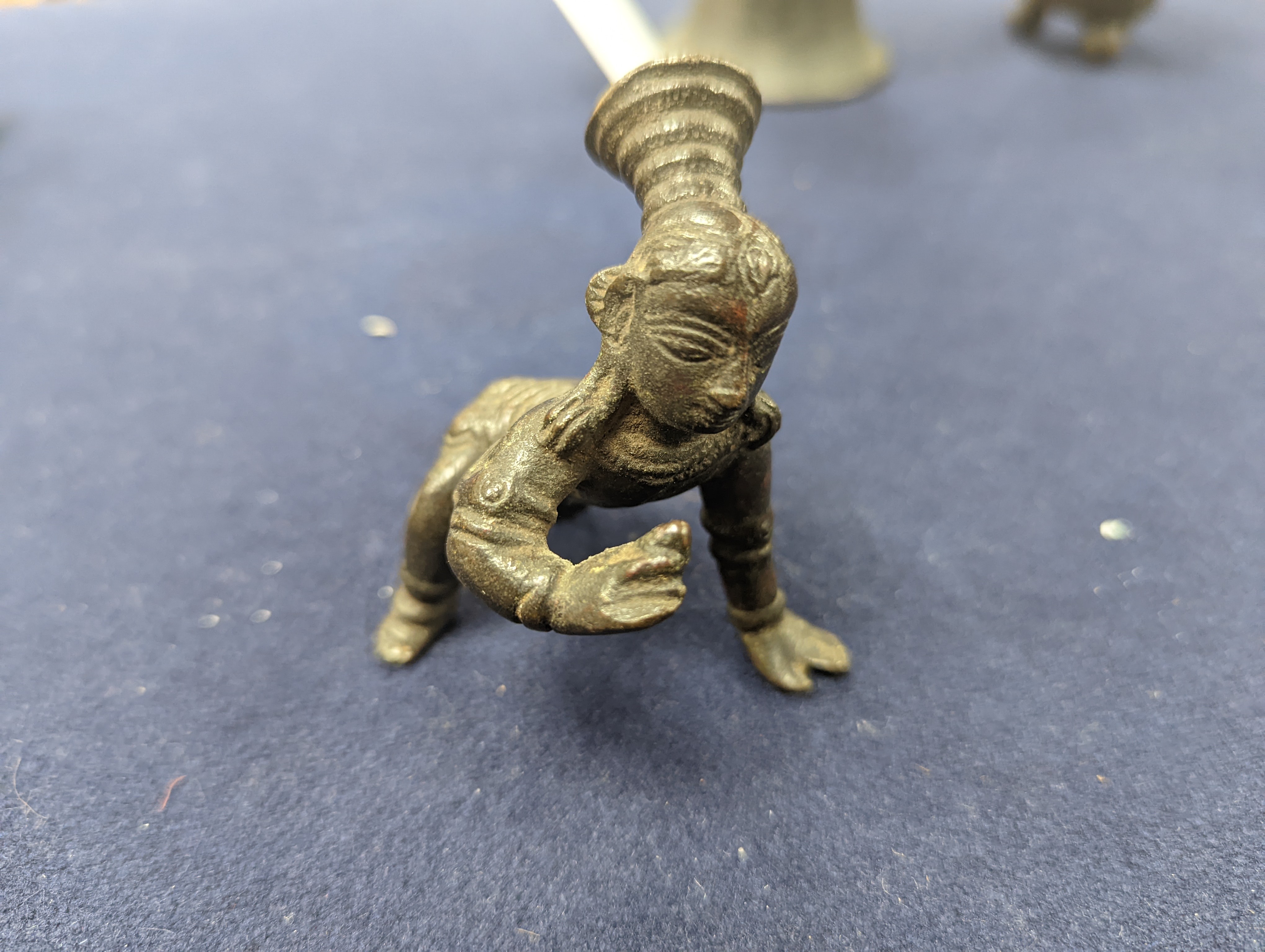 A Chinese gilt copper figure, a Chinese Dog of Fo, a bell, a censer, six Indian bronze figures and a scroll box